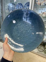 A Chinese monochrome blue Swatow dish with incised carp design, Ming